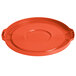 An orange plastic lid with a handle for a round container.