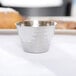 An American Metalcraft hammered stainless steel sauce cup.