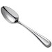 A Oneida Acclivity stainless steel spoon with an oval bowl and silver handle.