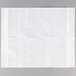 A white paper towel on a gray surface.