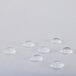 A close up of a white L.A. Baby crib mattress with water drops on the surface.