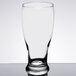 A Libbey pub glass on a table with a white background.