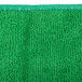A green Unger SmartColor microfiber cloth with a green border.