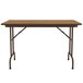 A medium oak rectangular Correll folding table with brown metal legs.