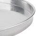 An American Metalcraft aluminum pizza pan with a silver rim.