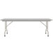 A white rectangular Correll folding table with gray legs.