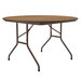 A Correll round folding table with medium oak wood surface and a brown metal frame.