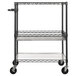 A black metal Alera wire cart with three shelves and wheels.