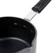 A close-up of a Thunder Group anodized aluminum sauce pan with a black handle.