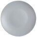 A close-up of a matte gray Tuxton china plate.