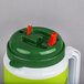A white and green 64 oz. Mountain Dew Tanker with a spout, straw, and lid.