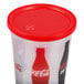 A 32 oz. plastic car cup with a red lid and Coca-Cola logo.