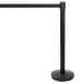 A black Lancaster Table & Seating crowd control stanchion with a black retractable belt.