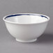 A white Schonwald porcelain bowl with a dark blue rim.