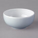 A light blue Schonwald porcelain dip dish with a small rim on a white surface.