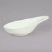 A white porcelain spoon with a bowl and handle.