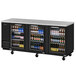 A black Turbo Air back bar cooler with glass doors filled with bottles of beer.