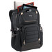 A black Solo polyester backpack with tan accents and red handle, open to show a laptop and tablet inside.