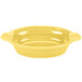 A yellow oval casserole dish with handles on a white surface.