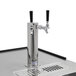 A Turbo Air black beer dispenser with two silver taps and black handles.