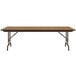 A Correll rectangular folding table with a medium oak wooden top and metal frame.