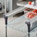 A Metro MS-RS36 Multi-Rail Set on a metal shelf with tomatoes.