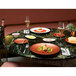 Villeroy & Boch Copper Glow porcelain plates on a table with food and champagne glasses.