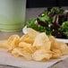 A plate of Martin's Kettle Gold potato chips and salad.