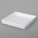 A white square resin-coated aluminum bowl with a textured finish.