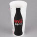 A white Solo paper cold cup with a black Coca-Cola logo and a black lid.