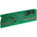 A close up of a green circuit board with many electronic components.