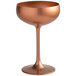 A Stolzle copper coupe glass with a stem.