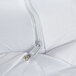 A close up of a zipper on a white JT Eaton box spring cover.
