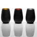 Three matte black and copper Stolzle stemless wine glasses on a white surface.