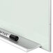 A Quartet white magnetic glass dry-erase board with a black marker on it.