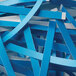 A pile of blue and white paper strips from a Swingline CS30-36 strip-cut shredder.