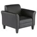 A black leather Alera club chair with wooden legs.