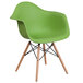 A green Flash Furniture Alonza plastic chair with wooden legs.
