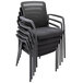 A stack of Alera black mesh guest chairs with arms.