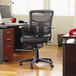 A black Alera Elusion office chair with a black mesh back.