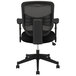 A black HON office chair with a black mesh back and wheels.