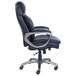 A black leather Serta office chair with chrome wheels and arms.