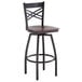 A Lancaster Table & Seating black and brown bar stool with a wooden seat.