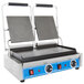A Globe Bistro double sandwich grill with smooth plates on a counter in a professional kitchen.