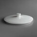 A white Schonwald Allure porcelain bowl lid on a table.