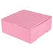 A pink Baker's Mark cupcake box with a white background.