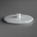 A Schonwald bone white porcelain bowl lid with a small knob on top.