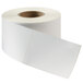 A roll of white labels with a white border.
