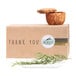 A box of Avery Matte White Round Labels with a sprig of rosemary on it.