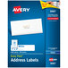 A blue and white box of Avery Easy Peel white mailing address labels.